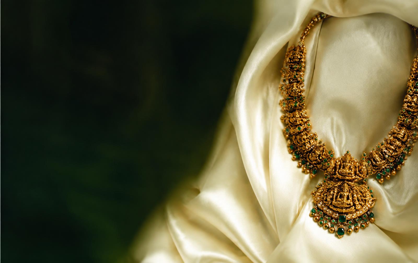Gold temple necklace on ivory silk
